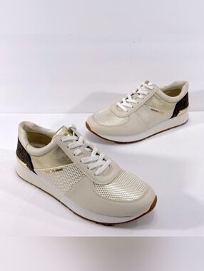 Michael Kors Allie Trainers in a white and gold colorway. Size 6.5